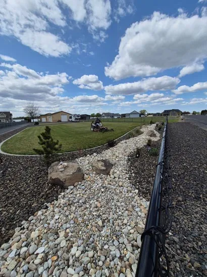 Decorative rock dry creek bed landscaping in Moses Lake, WA