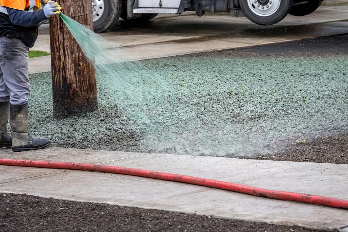 Hydroseed mulch being sprayed onto bare soil - hydroseeding in Moses Lake, WA